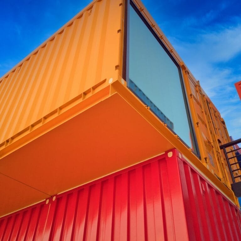 yellow and red wooden building under blue sky during daytime