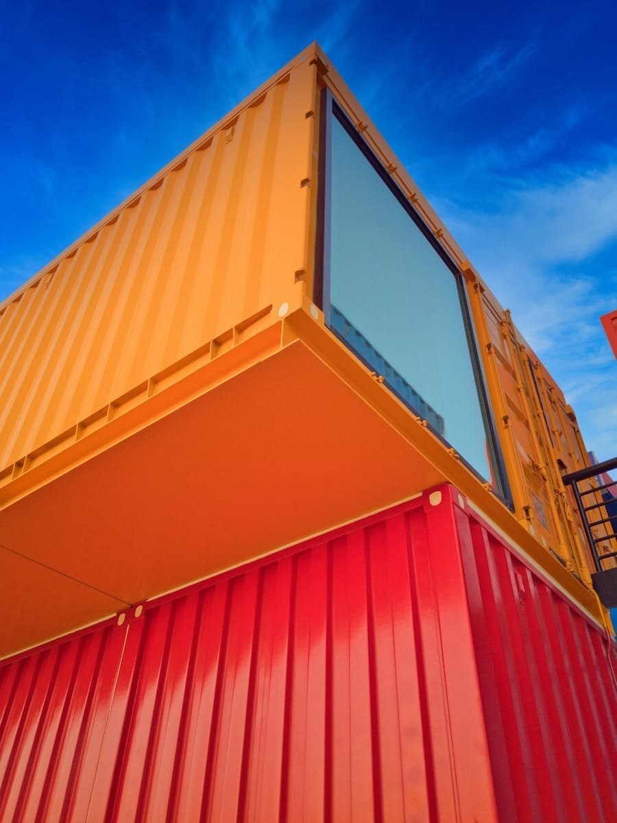 yellow and red wooden building under blue sky during daytime